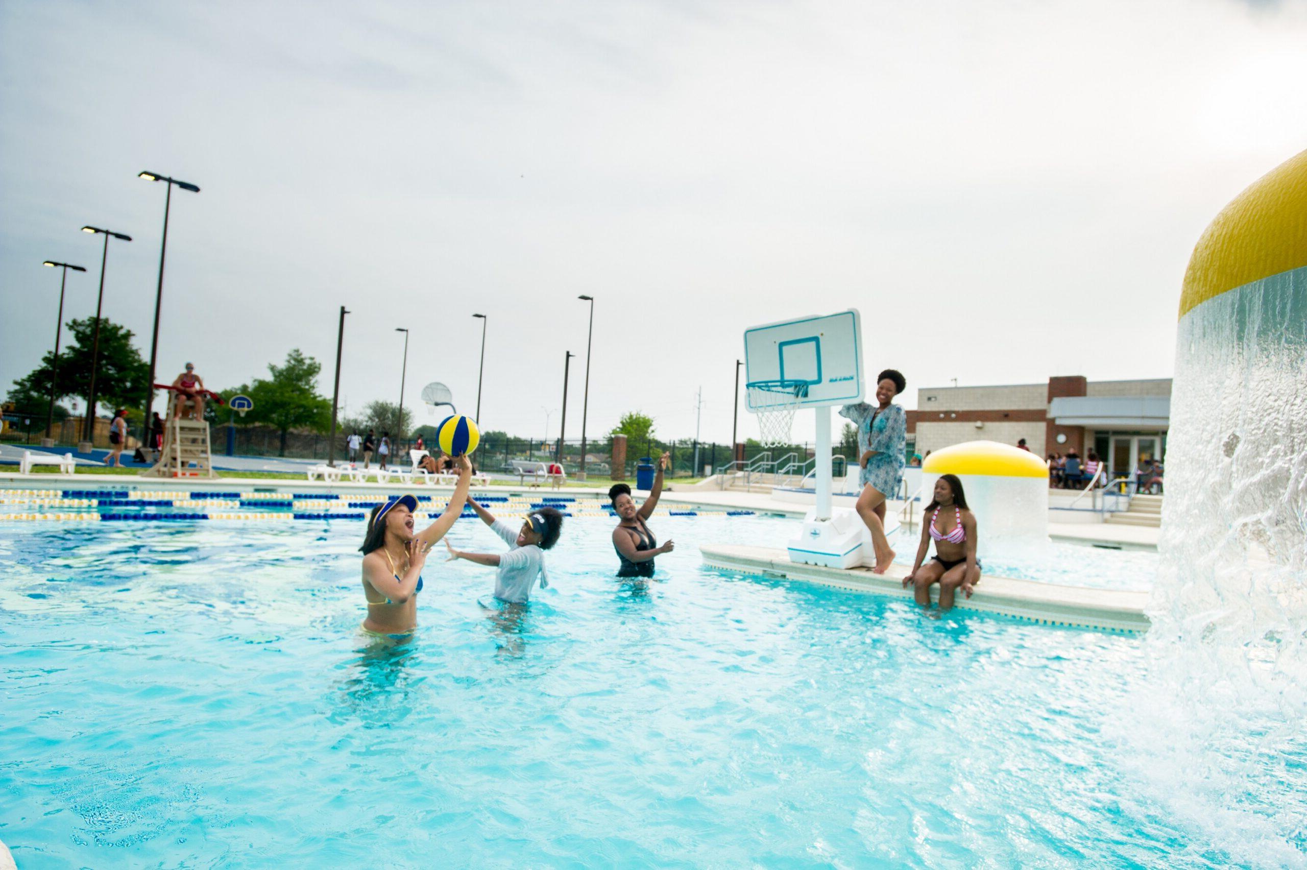 Students playing in water at the pool at the MRC